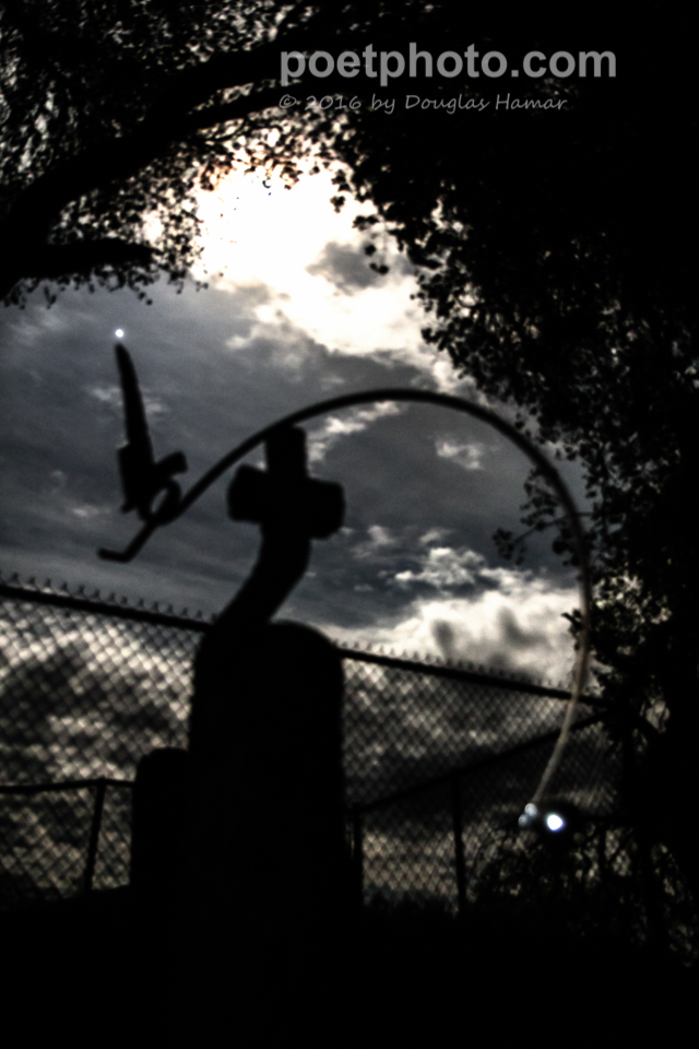 The sculpture is pointing to Jupiter upper left. Lower right is a large ball bearing reflecting a flashlight.